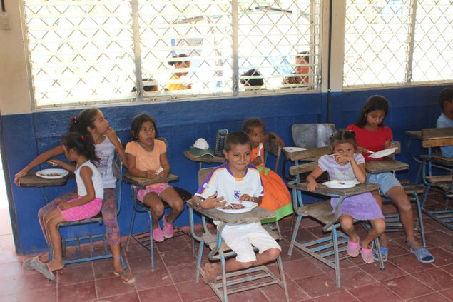Sharing our Gallo Pinto and peanut butter sandwiches with the children