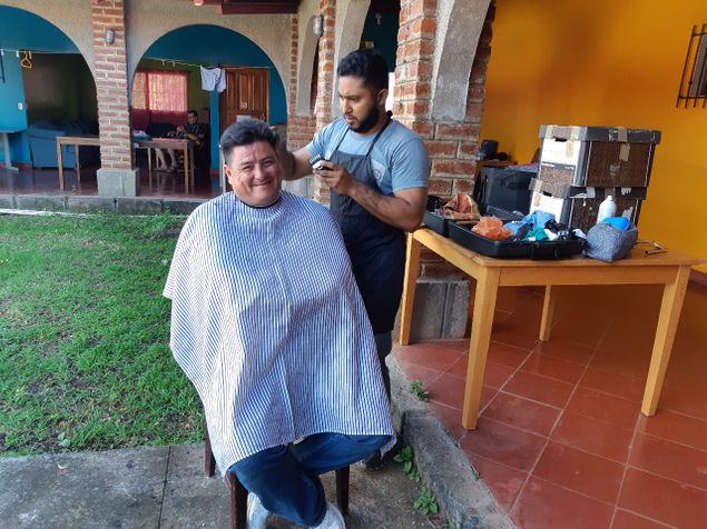 Edgar getting haircut from our worker Roger prior to us setting out.He self taught on you tube but gives a remarkable haircut.
