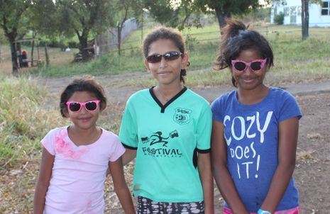 These 3 girls were off to clean the church but accepted sunglasses but refused mop picture