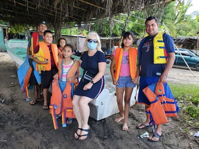 Three fishing families received life jackets to keep them safe in the water